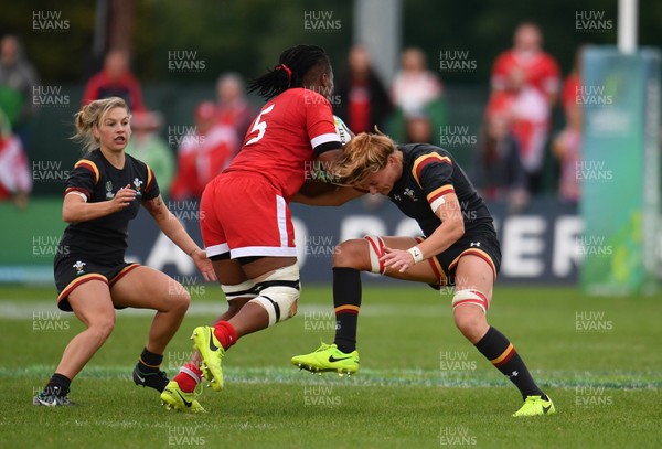 130817 - Canada v Wales - Women's Rugby World Cup - Latoya Blackwood of Canada  in action against Kiera Bevan and Rachel Taylor of Wales
