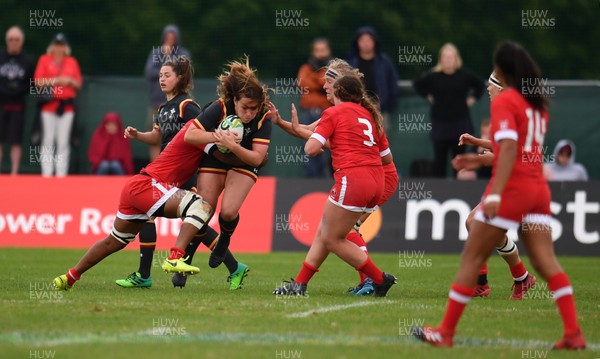 130817 - Canada v Wales - Women's Rugby World Cup - Cerys Hale of Wales is tackled by Latoya Blackwood of Canada