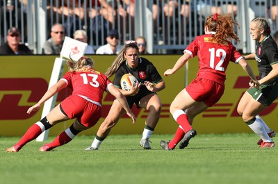 270822 - Canada Women v Wales Women, Summer 15’s World Cup Warm up match - Kayleigh Powell of Wales takes on Alexandra Tessier of Canada and Sara Kaljuvee of Canada