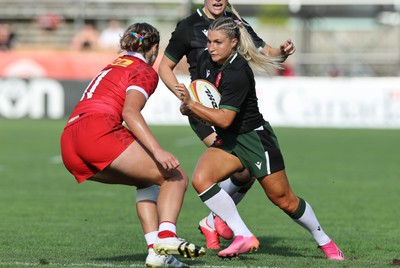 270822 - Canada Women v Wales Women, Summer 15’s World Cup Warm up match - Lowri Norkett of Wales takes on Maddy Grant of Canada