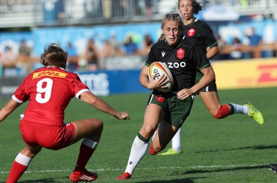 270822 - Canada Women v Wales Women, Summer 15’s World Cup Warm up match - Hannah Jones of Wales takes on Brianna Miller of Canada