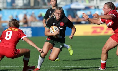 270822 - Canada Women v Wales Women, Summer 15’s World Cup Warm up match - Hannah Jones of Wales takes on Brianna Miller of Canada