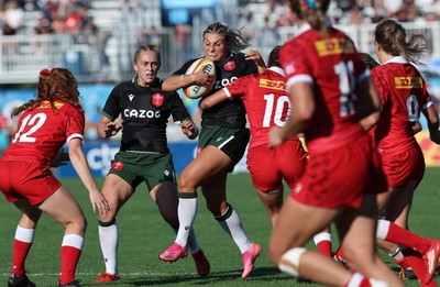 270822 - Canada Women v Wales Women, Summer 15’s World Cup Warm up match - Lowri Norkett of Wales is tackled by Taylor Perry of Canada