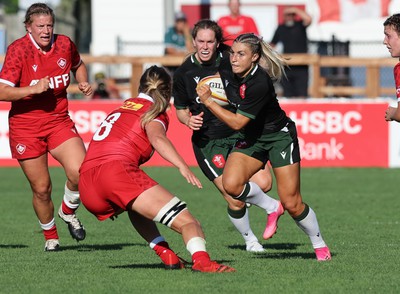 270822 - Canada Women v Wales Women, Summer 15’s World Cup Warm up match - Lowri Norkett of Wales takes on Sophie de Goede of Canada