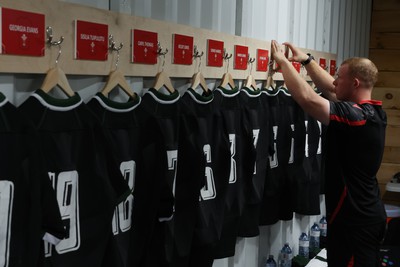 270822 - Canada Women v Wales Women, Summer 15’s World Cup Warm up match - Jamie Cox places the final name plaque on the wall in the changing room