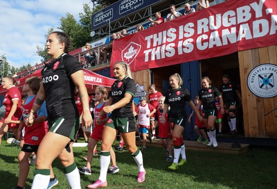 270822 - Canada Women v Wales Women, Summer 15’s World Cup Warm up match - Ffion Lewis of Wales and Lowri Norkett of Wales walk out for the start of the match