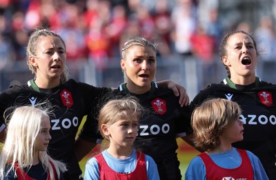 270822 - Canada Women v Wales Women, Summer 15’s World Cup Warm up match - Elinor Snowsill, Lowri Norkett and Ffion Lewis of Wales sing out the national anthem at the start of the match