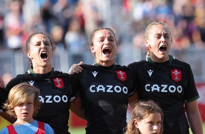 270822 - Canada Women v Wales Women, Summer 15’s World Cup Warm up match - Ffion Lewis of Wales, Jasmine Joyce and Hannah Jones of Wales during the national anthems