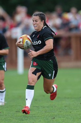 270822 - Canada Women v Wales Women, Summer 15’s World Cup Warm up match - Ffion Lewis of Wales takes on Paige Farries of Canada