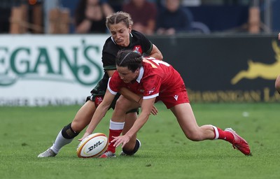 270822 - Canada Women v Wales Women, Summer 15’s World Cup Warm up match - Jasmine Joyce of Wales and Elissa Alarie of Canada compete for the ball