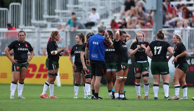 270822 - Canada Women v Wales Women, Summer 15’s World Cup Warm up match - Wales team members take on water during a break for an injury