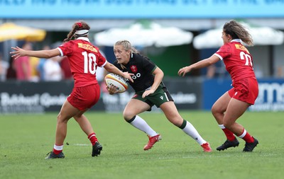 270822 - Canada Women v Wales Women, Summer 15’s World Cup Warm up match - Hannah Jones of Wales takes on Taylor Perry of Canada