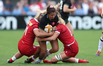 270822 - Canada Women v Wales Women, Summer 15’s World Cup Warm up match - Kayleigh Powell of Wales is tackled