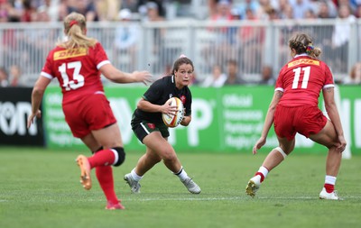 270822 - Canada Women v Wales Women, Summer 15’s World Cup Warm up match - Kayleigh Powell of Wales takes on Sara Kaljuvee of Canada and Maddy Grant of Canada