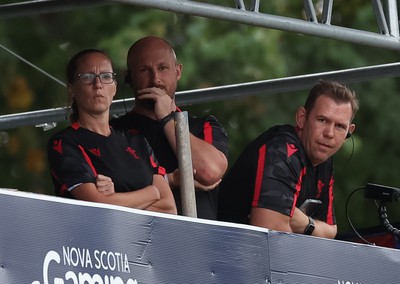 270822 - Canada Women v Wales Women, Summer 15’s World Cup Warm up match - Wales coaches Louise Jones, Mike Hill and Head Coach Ioan Cunningham watch the match