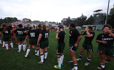 270822 - Canada Women v Wales Women, Summer 15’s World Cup Warm up match - Players embrace each other at the end of the match