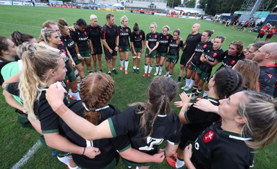 270822 - Canada Women v Wales Women, Summer 15’s World Cup Warm up match - Wales players huddle at the end of the match