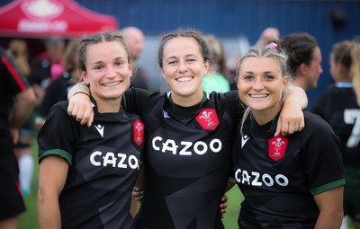 270822 - Canada Women v Wales Women, Summer 15’s World Cup Warm up match - Jasmine Joyce, Ffion Lewisand Lowri Norkett of Wales at the end of the match