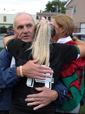 270822 - Canada Women v Wales Women, Summer 15’s World Cup Warm up match - Lowri Norkett of Wales with parents Caroline and Kim at the end of the match