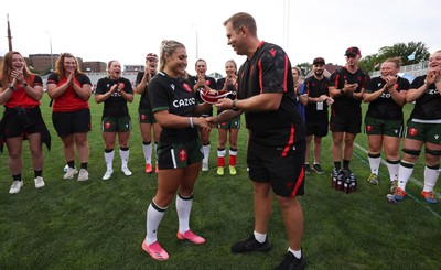 270822 - Canada Women v Wales Women, Summer 15’s World Cup Warm up match - Head coach Ioan Cunningham makes first cap presentation to Lowri Norkett of Wales