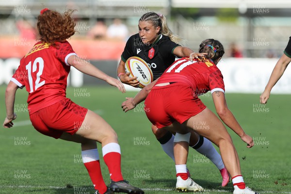 270822 - Canada Women v Wales Women, Summer 15’s World Cup Warm up match - Lowri Norkett of Wales takes on Maddy Grant of Canada