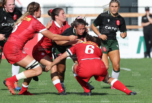 270822 - Canada Women v Wales Women, Summer 15’s World Cup Warm up match - Kayleigh Powell of Wales is tackled by Fabiola Forteza of Canada and Taylor Perry of Canada