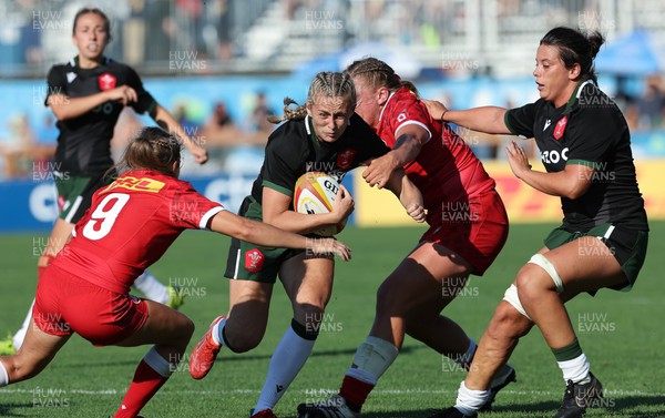 270822 - Canada Women v Wales Women, Summer 15’s World Cup Warm up match - Hannah Jones of Wales takes on Brianna Miller of Canada