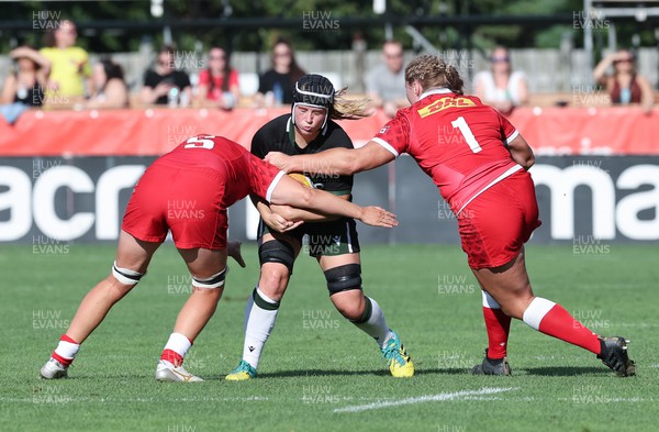 270822 - Canada Women v Wales Women, Summer 15’s World Cup Warm up match - Beth Lewis of Wales is tackled by Tyson Beukeboom of Canada and Olivia DeMerchant of Canada