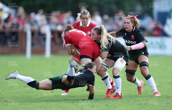 270822 - Canada Women v Wales Women, Summer 15’s World Cup Warm up match - Jasmine Joyce, Manon Johnes of Wales and Georgia Evans of Wales look to stop Karen Paquin of Canada