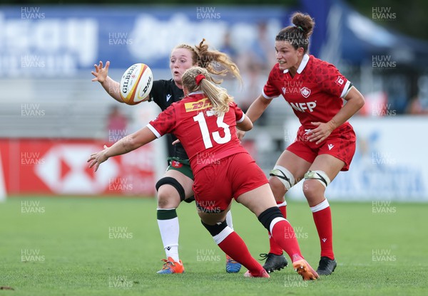 270822 - Canada Women v Wales Women, Summer 15’s World Cup Warm up match - Abbie Fleming of Wales looks to win the ball from Sara Kaljuvee of Canada