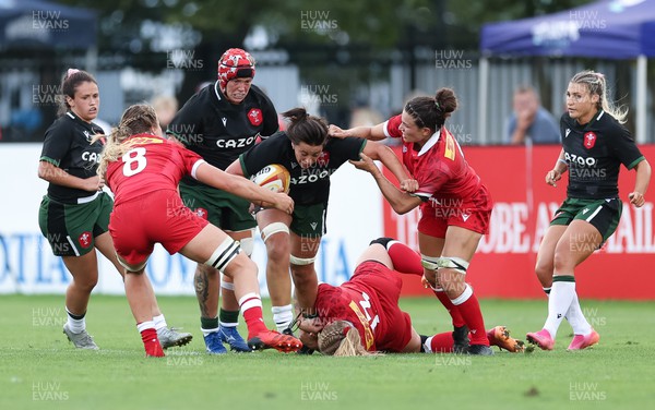 270822 - Canada Women v Wales Women, Summer 15’s World Cup Warm up match - Sioned Harries of Wales is held by Sara Kaljuvee of Canada, Sophie de Goede of Canada and Fabiola Forteza of Canada