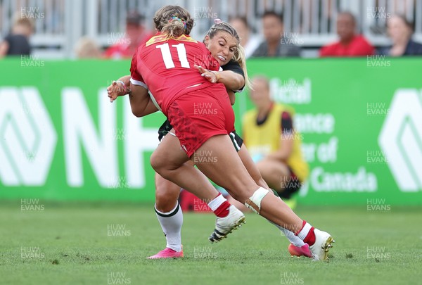270822 - Canada Women v Wales Women, Summer 15’s World Cup Warm up match - Lowri Norkett of Wales tackles Maddy Grant of Canada