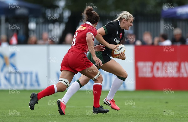 270822 - Canada Women v Wales Women, Summer 15’s World Cup Warm up match - Carys Williams-Morris of Wales gets away from Fabiola Forteza of Canada