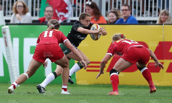 270822 - Canada Women v Wales Women, Summer 15’s World Cup Warm up match - Caitlin Lewis of Wales takes on Sara Kaljuvee of Canada and Maddy Grant of Canada