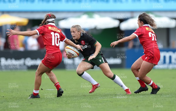 270822 - Canada Women v Wales Women, Summer 15’s World Cup Warm up match - Hannah Jones of Wales takes on Taylor Perry of Canada
