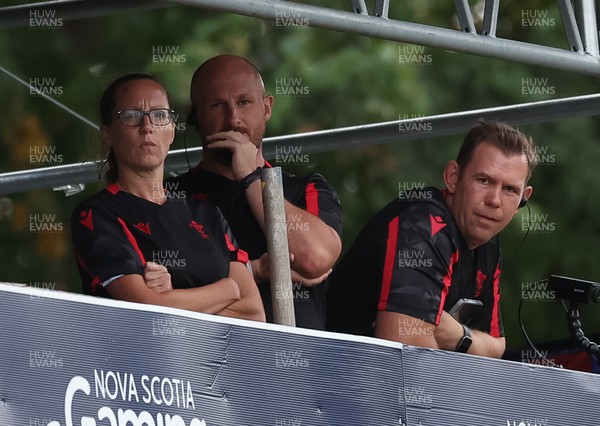 270822 - Canada Women v Wales Women, Summer 15’s World Cup Warm up match - Wales coaches Louise Jones, Mike Hill and Head Coach Ioan Cunningham watch the match