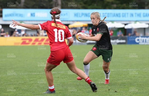 270822 - Canada Women v Wales Women, Summer 15’s World Cup Warm up match - Hannah Jones of Wales takes on Taylor Perry of Canada