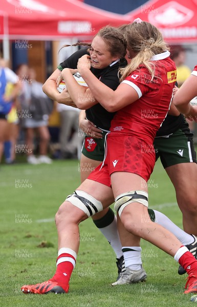 270822 - Canada Women v Wales Women, Summer 15’s World Cup Warm up match - Caitlin Lewis of Wales is held 