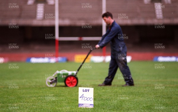 250497 - Assistant groundsman Clive Jones prepares the pitch at the National Stadium, Cardiff Arms Park on lot 4000 which will be auctioned