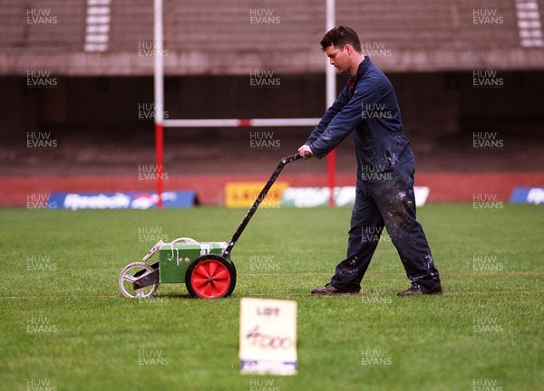 250497 - Assistant groundsman Clive Jones prepares the pitch at the National Stadium, Cardiff Arms Park on lot 4000 which will be auctioned