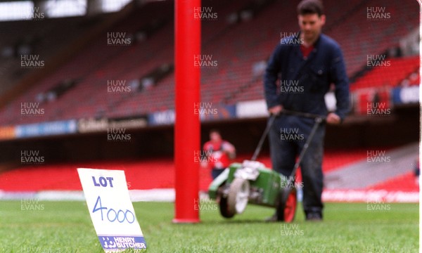 250497 - Assistant groundsman Clive Jones prepares the pitch at the National Stadium, Cardiff Arms Park on lot 4000 which will be auctioned