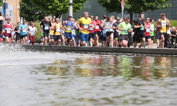 220522 - Brecon Carreg Cardiff Bay Run 10k - Runners make their way around the course