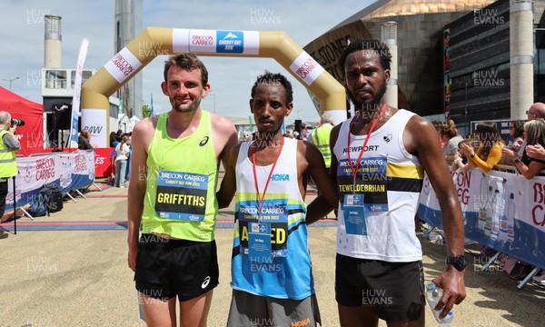 220522 - Brecon Carreg Cardiff Bay Run 10k - Omar Ahmed, centre, winner of the race with Dewi Griffiths, 2nd and Abed Teweldebrhan, third