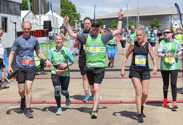 220522 - Brecon Carreg Cardiff Bay Run 10k - Runners celebrate at the end