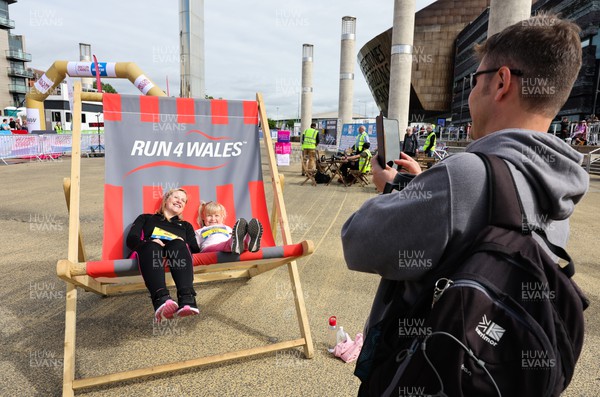 220522 - Brecon Carreg Cardiff Bay Run 10k - Runners use the Run4Wales deckchair