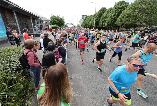 220522 - Brecon Carreg Cardiff Bay Run 10k - Competitors head off at the start of the event