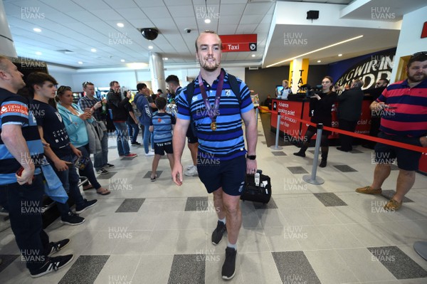 130518 - Cardiff Blues Arrival - Kristian Dacey arrives at Cardiff Airport after winning the European Rugby Challenge Cup