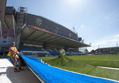 250713 - Cardiff Blues Pitch Renovation -Work continues at Arms Park on Cardiff Blues pitch as the new artificial pitch is laid down by workers