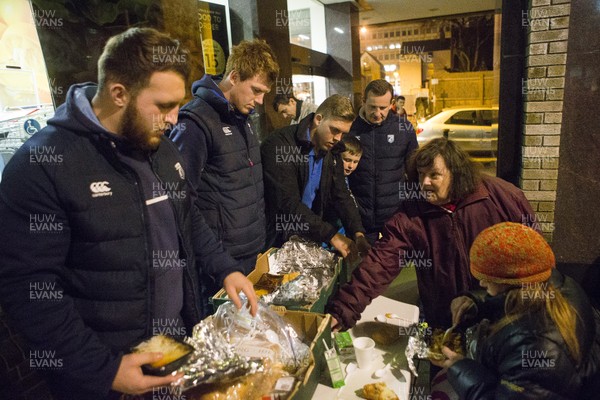 071215 - Cardiff Blues players feed the homeless on Charles Street, Cardiff -