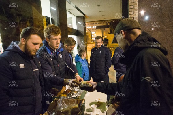 071215 - Cardiff Blues players feed the homeless on Charles Street, Cardiff -